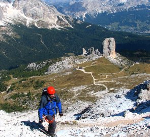 Climb through the rubble to the top, below us the rock towers of Cinque Tori