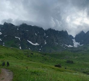 The peaks of the mountains were still shrouded in heavy clouds