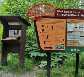 Information sign with a book where you can sign in.