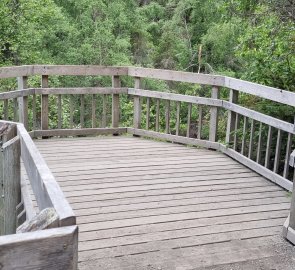 A wooden lookout at the end of the road.